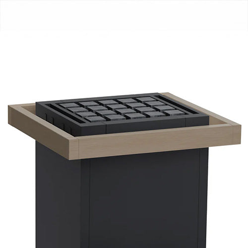 A designer electric sauna heater with a dark charcoal gray body, a light beige wood frame, and a black metal grate insert on top, shown against a plain white background.